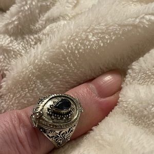 Sterling silver locket ring. I think the stone is amethyst. Size 7-8